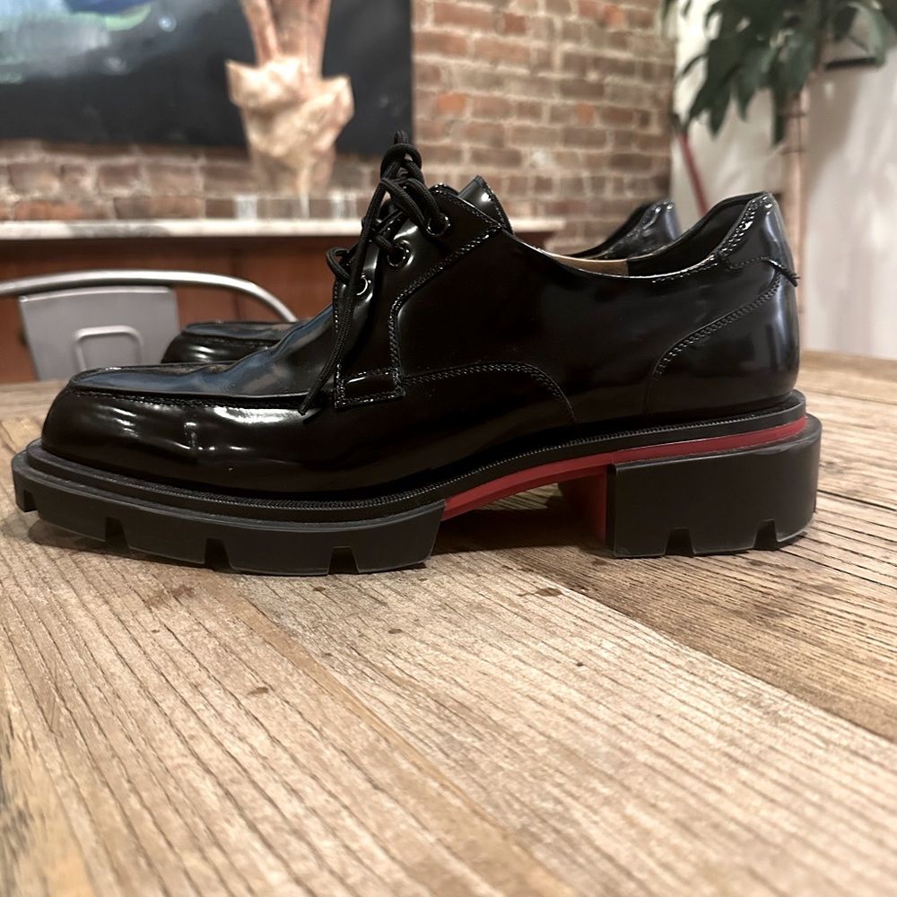 Louboutin our George’s patent leather derby